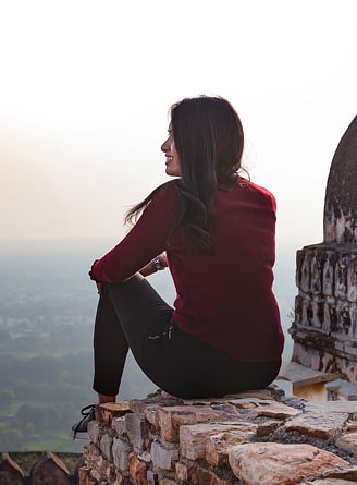 Woman watching the view from Chittorgarh Fort, Rajasthan