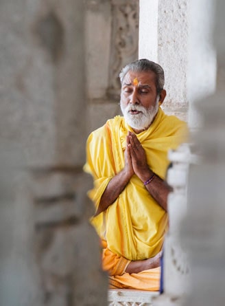 Man praying at Dilwara Temples, Mount Abu, Rajasthan
