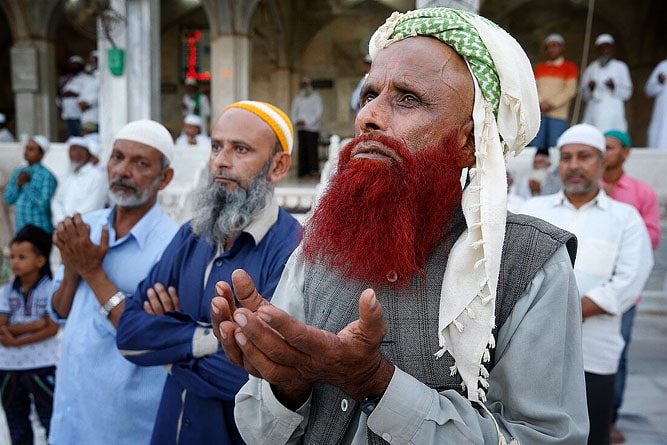 Muslim man praying at Ajmer Sharif Dargah, Ajmer, Rajasthan