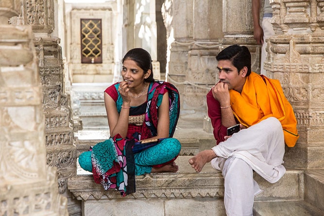 Man and woman seating at Ranakpur Jain Temple, Rajasthan