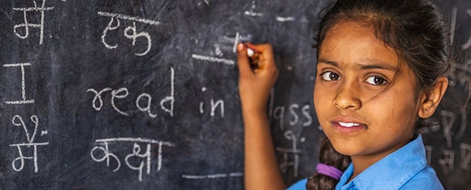 Student writing in Hindi language